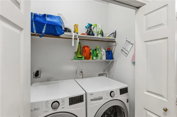 a utility room with dryer and washer