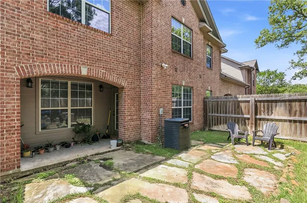 a backyard of a house with seating space