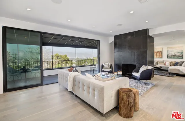 a view of sitting area with furniture and floor to ceiling window