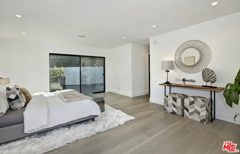 a bathroom with a sink vanity and a mirror