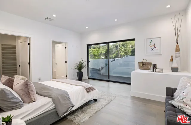 a view of a chairs and table in the roof deck