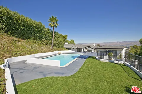 an aerial view of a house with a garden