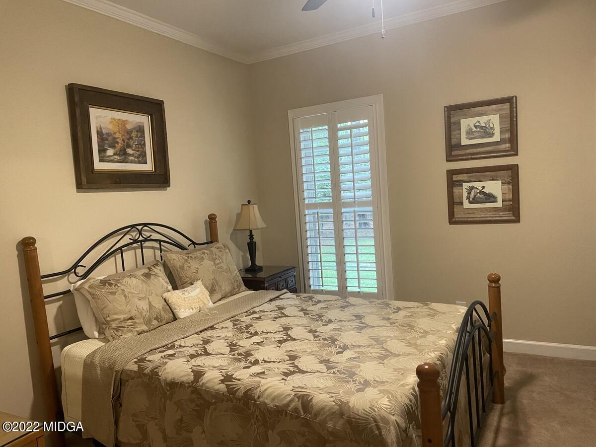 1715 Maynards Mill Road Forsyth, GA 31029 - Photo 18 of 36 a bedroom with a bed and a window