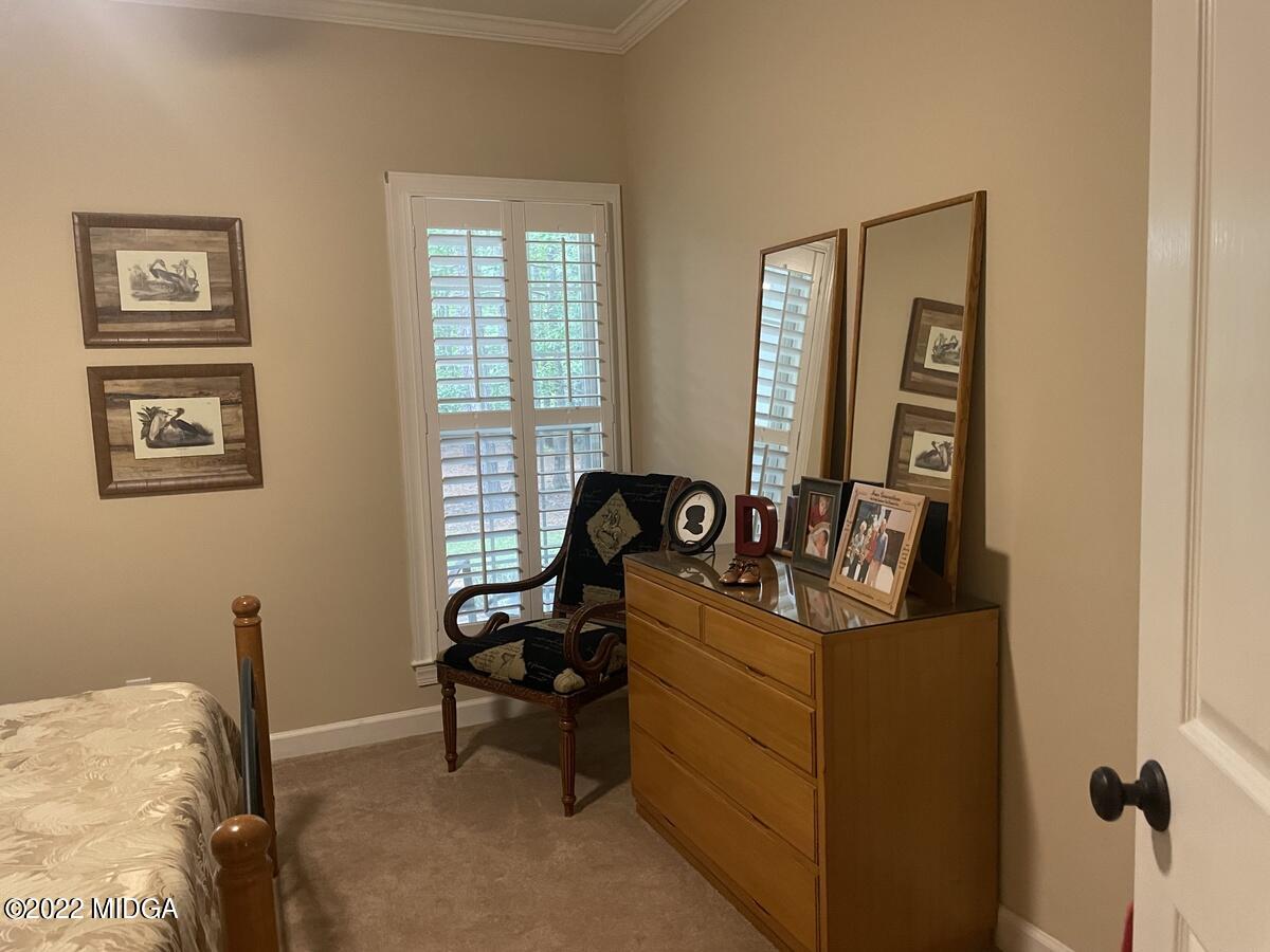 1715 Maynards Mill Road Forsyth, GA 31029 - Photo 19 of 36 a living room with furniture and a window