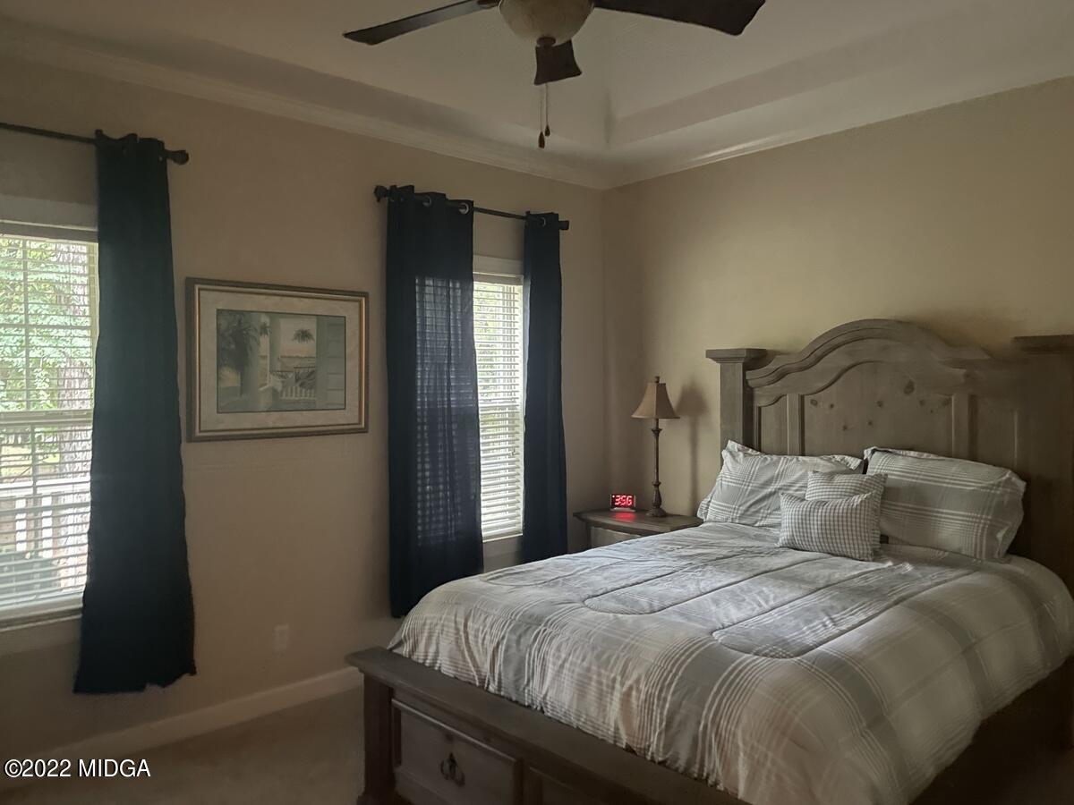 1715 Maynards Mill Road Forsyth, GA 31029 - Photo 20 of 36 a bedroom with a bed and a window