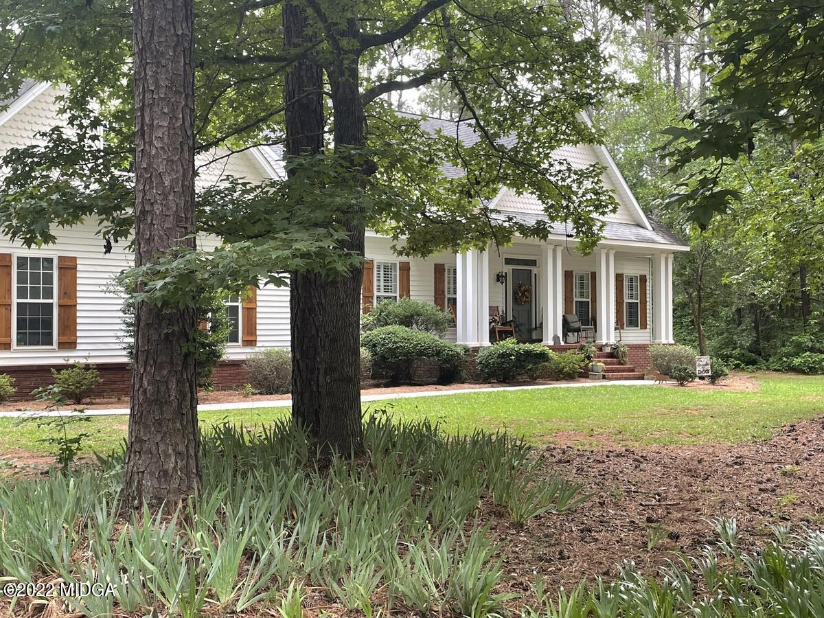 1715 Maynards Mill Road Forsyth, GA 31029 - Photo 2 of 36 a front view of house with yard and green space
