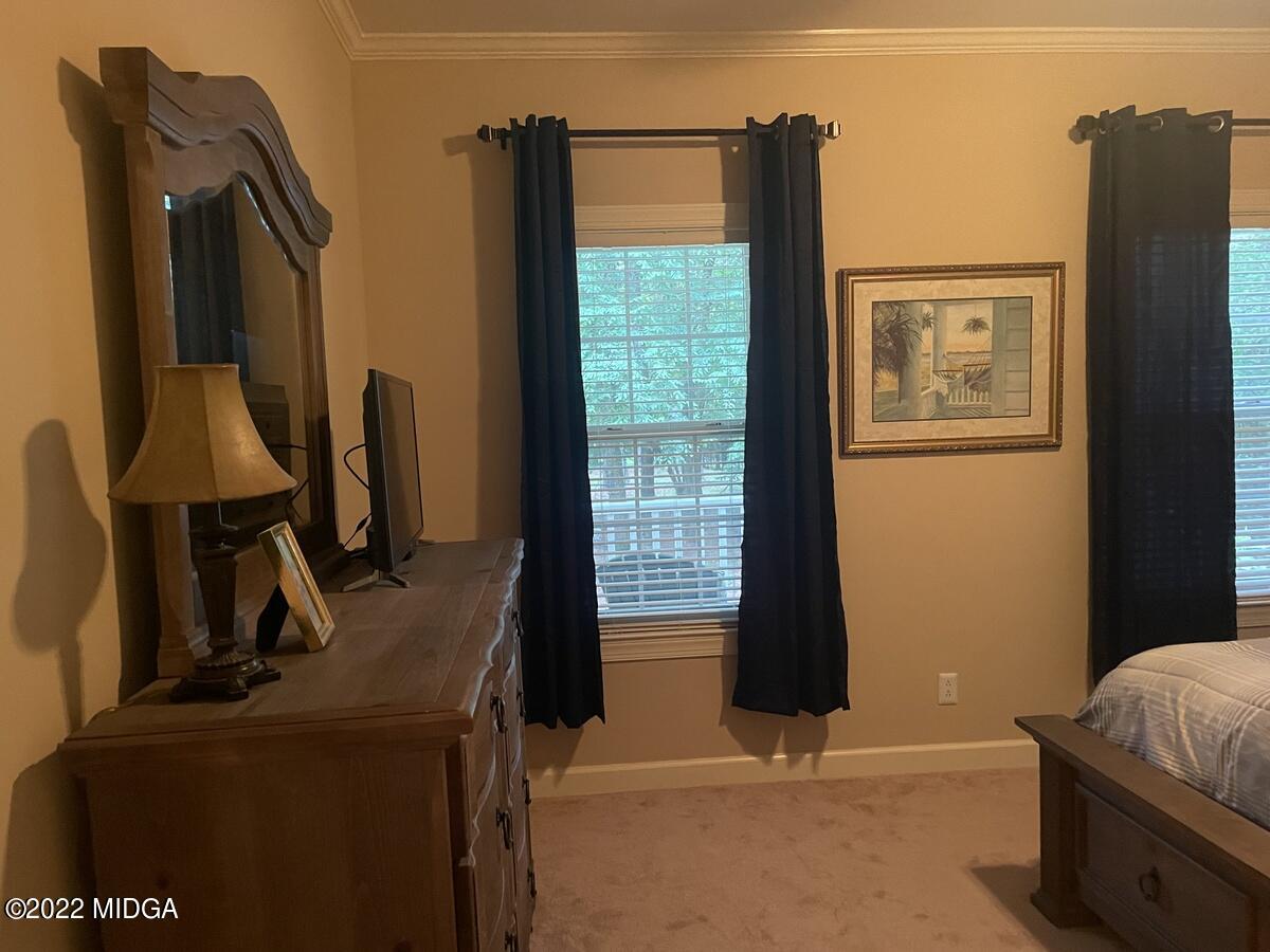 1715 Maynards Mill Road Forsyth, GA 31029 - Photo 21 of 36 a view of a living room with a flat tv screen and a dresser