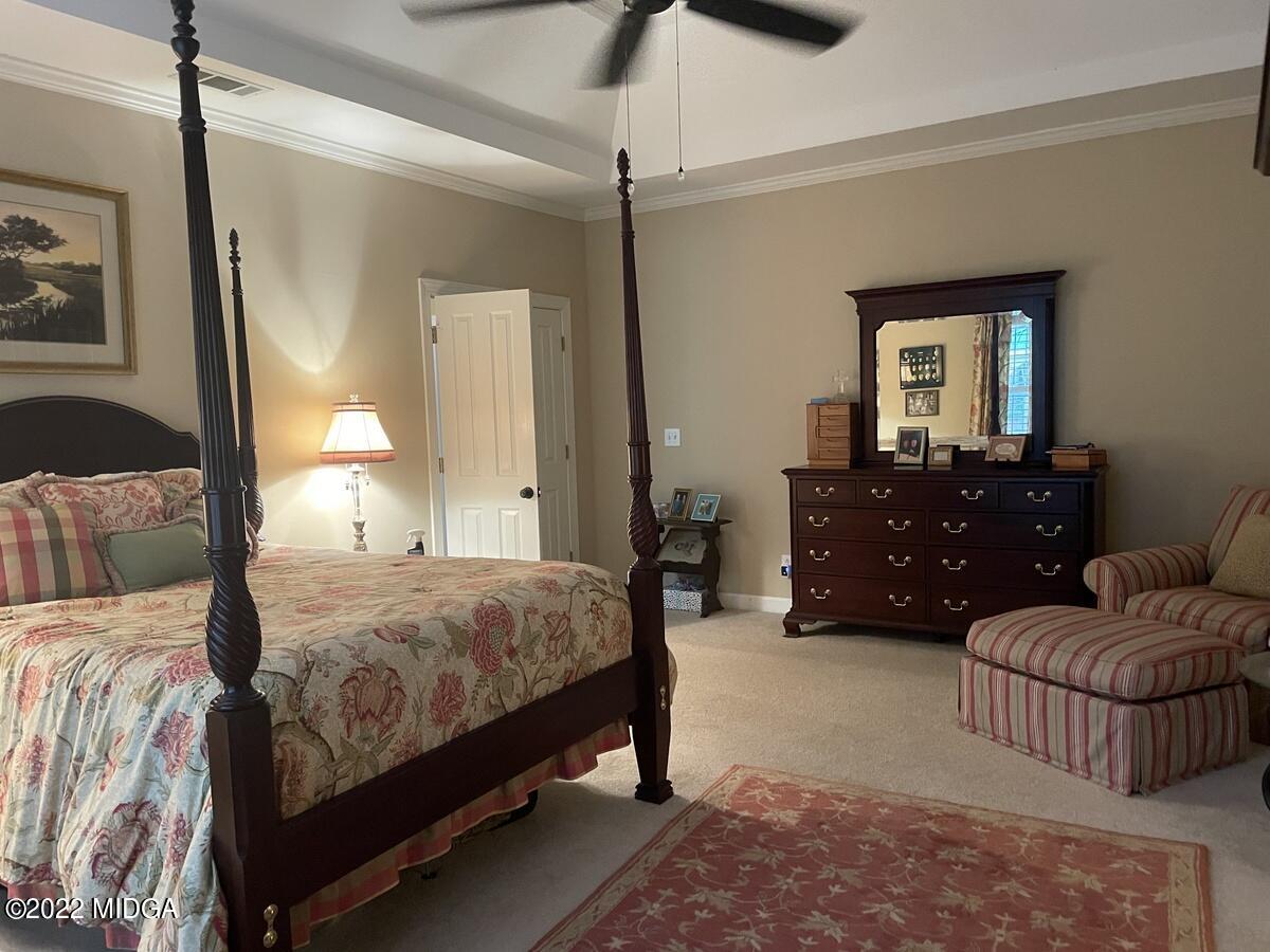 1715 Maynards Mill Road Forsyth, GA 31029 - Photo 25 of 36 a bedroom with a bed and ceiling fan