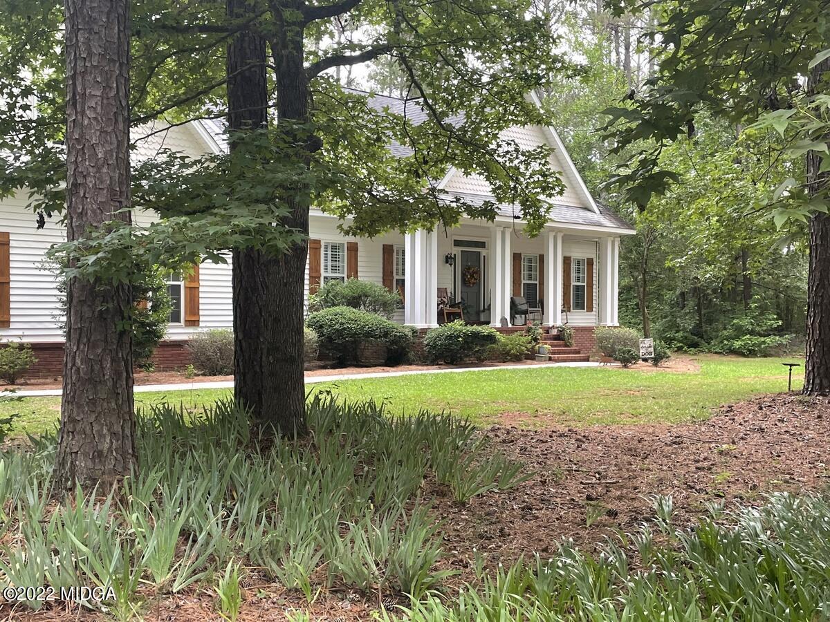 1715 Maynards Mill Road Forsyth, GA 31029 - Photo 4 of 36 a front view of house with yard and green space