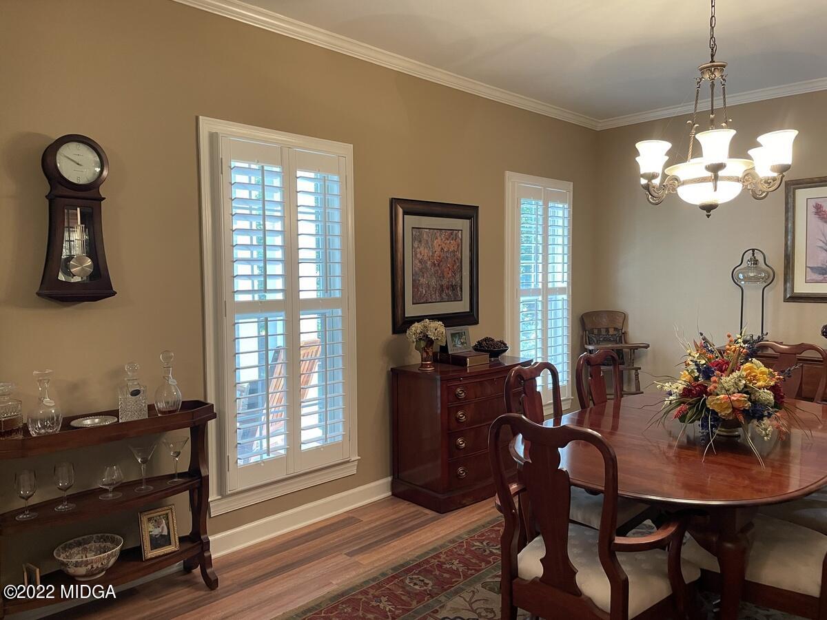 1715 Maynards Mill Road Forsyth, GA 31029 - Photo 7 of 36 a view of a dining room with furniture and chandelier
