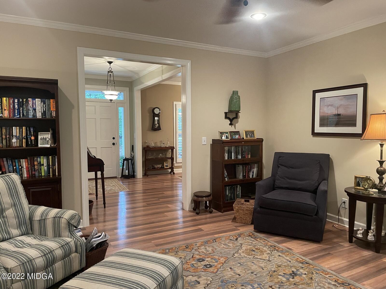 1715 Maynards Mill Road Forsyth, GA 31029 - Photo 8 of 36 a living room with furniture and wooden floor