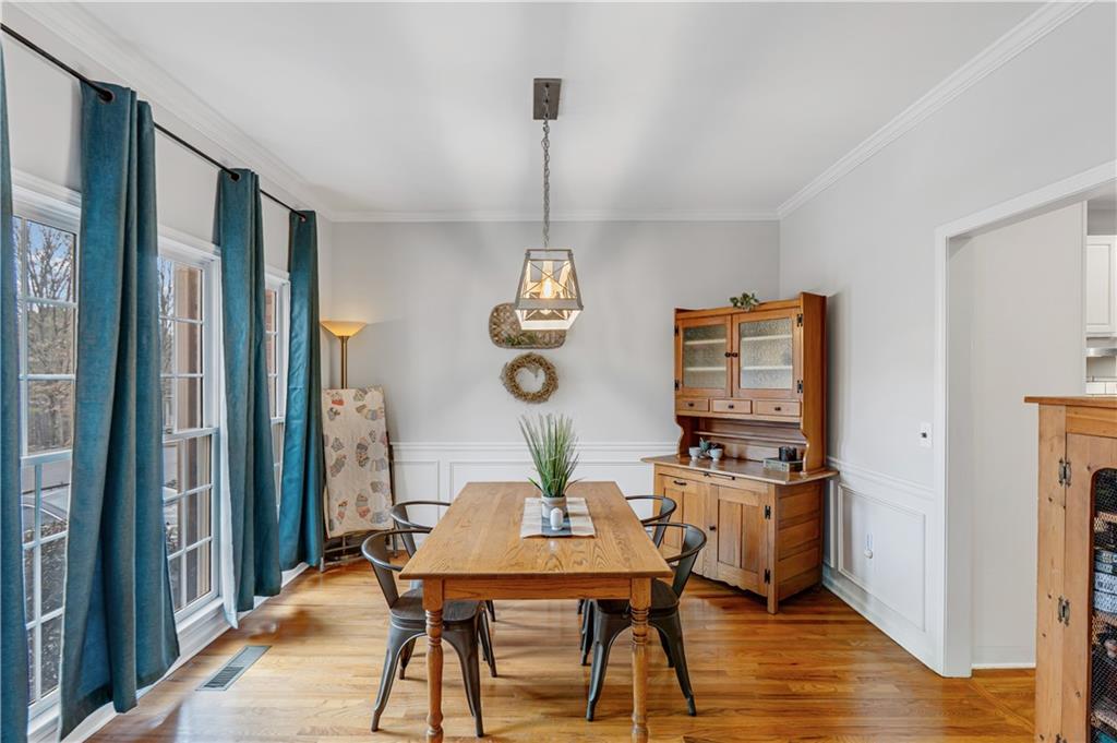 860 Valley Drive Canton, GA 30114 - Photo 18 of 62 a view of a dining room with furniture window and wooden floor