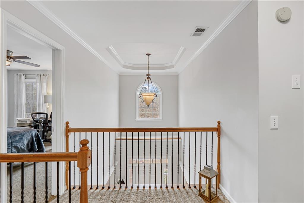 860 Valley Drive Canton, GA 30114 - Photo 30 of 62 a view of a hallway with a chandelier
