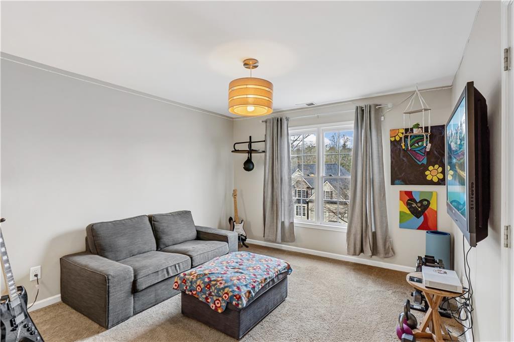 860 Valley Drive Canton, GA 30114 - Photo 38 of 62 a bedroom with furniture and a window