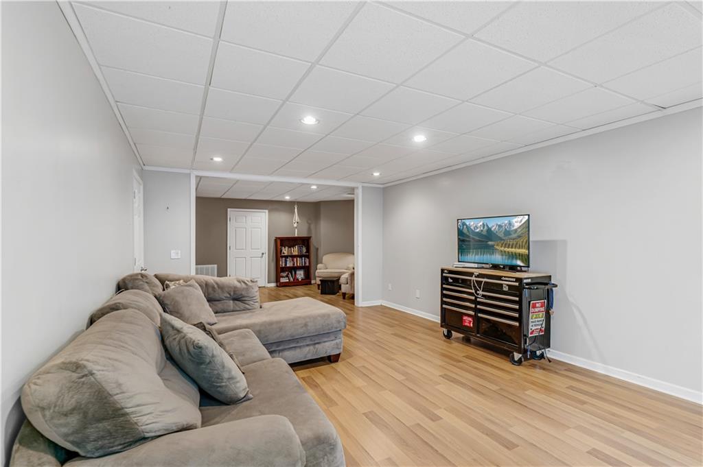 860 Valley Drive Canton, GA 30114 - Photo 39 of 62 a living room with furniture and wooden floor