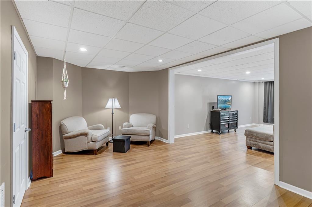 860 Valley Drive Canton, GA 30114 - Photo 42 of 62 a living room with furniture and a wooden floor