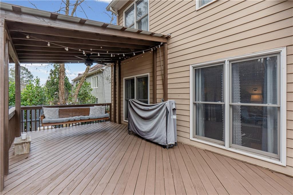 860 Valley Drive Canton, GA 30114 - Photo 44 of 62 a view of a roof deck with a table and chairs