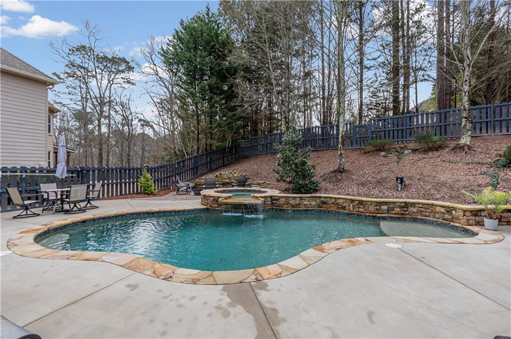 860 Valley Drive Canton, GA 30114 - Photo 46 of 62 a view of a swimming pool with a patio