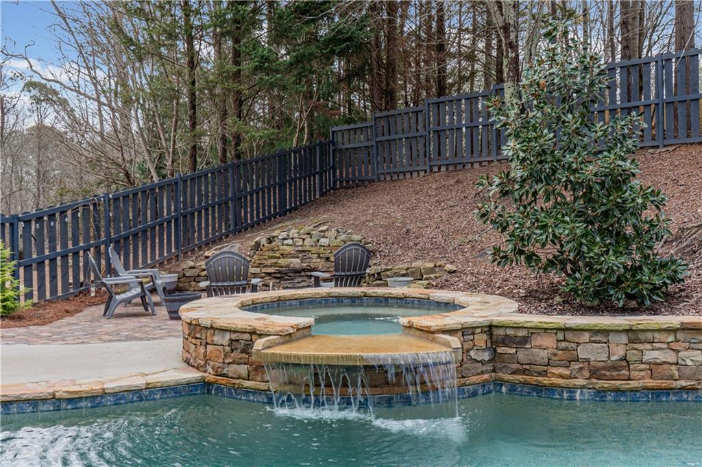 860 Valley Drive Canton, GA 30114 - Photo 47 of 62 a view of a lake with couches chairs and wooden floor