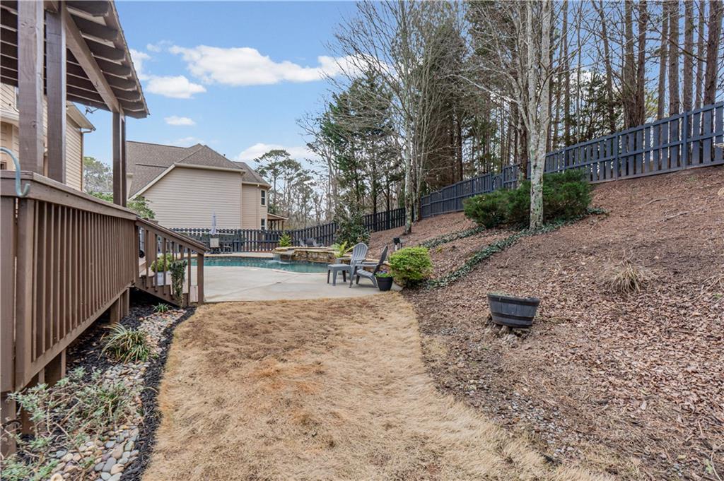 860 Valley Drive Canton, GA 30114 - Photo 48 of 62 a view of backyard with outdoor seating and wooden fence