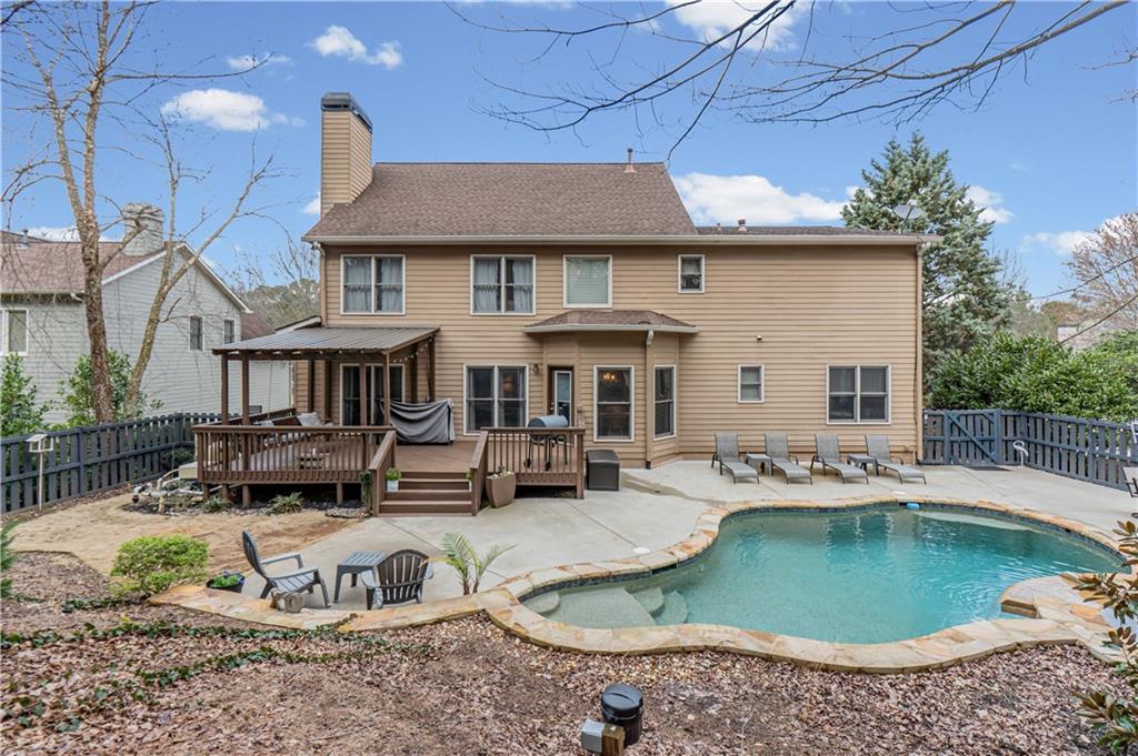860 Valley Drive Canton, GA 30114 - Photo 50 of 62 a view of a house with swimming pool and sitting area