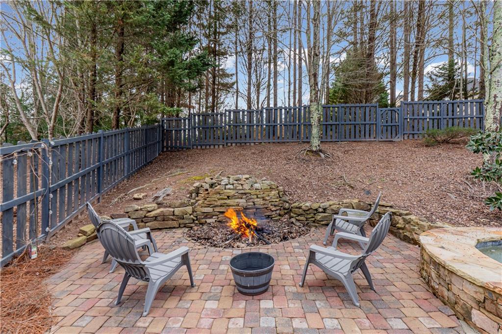 860 Valley Drive Canton, GA 30114 - Photo 53 of 62 a view of a chairs and table in backyard
