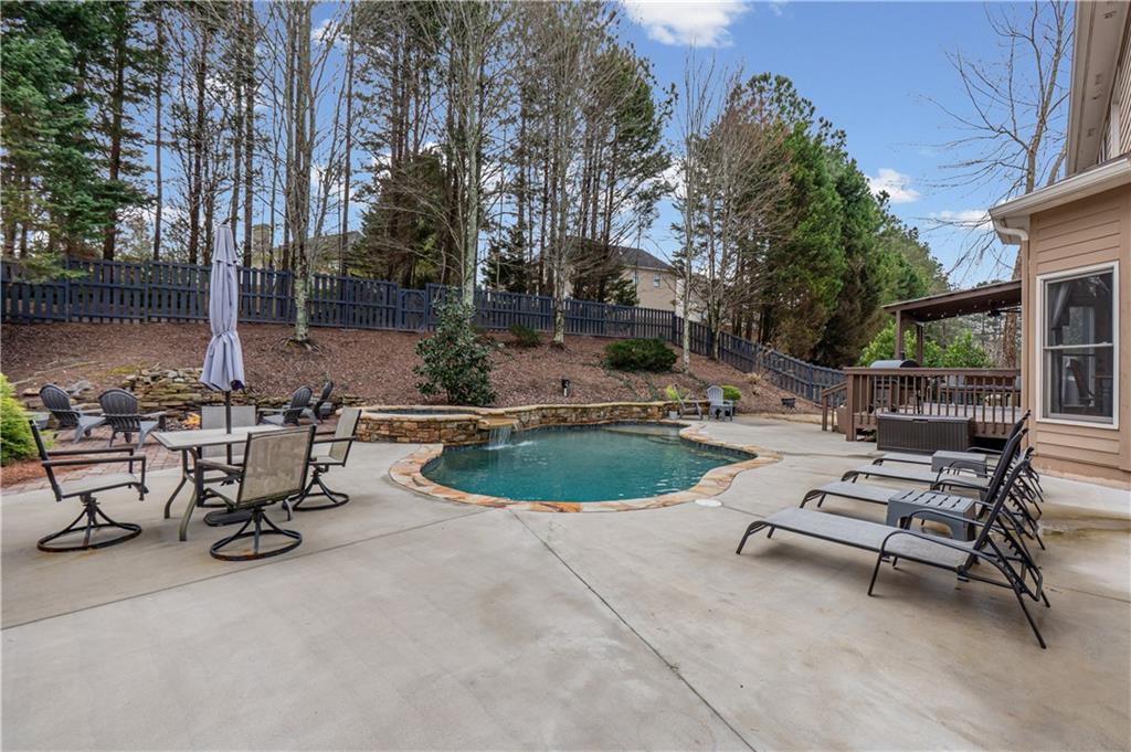 860 Valley Drive Canton, GA 30114 - Photo 54 of 62 a view of backyard with swimming pool and outdoor seating