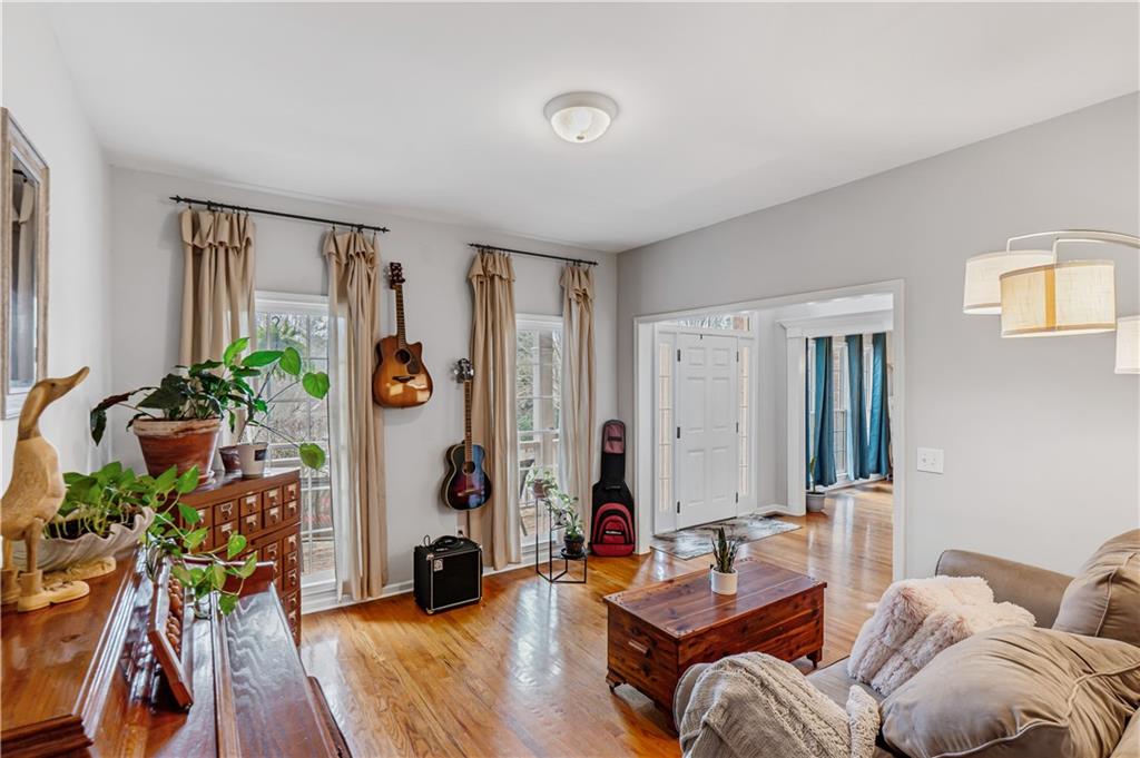 860 Valley Drive Canton, GA 30114 - Photo 8 of 62 a living room with furniture and a potted plant