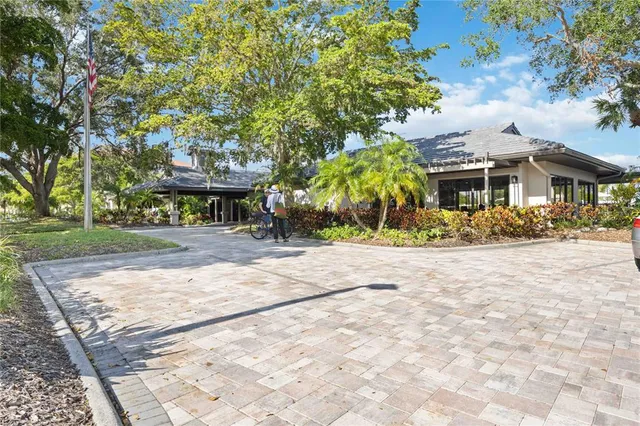 an aerial view of residential houses with outdoor space and street view