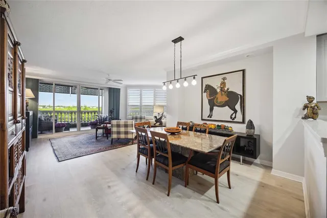 a very nice looking dining room with a table and chairs