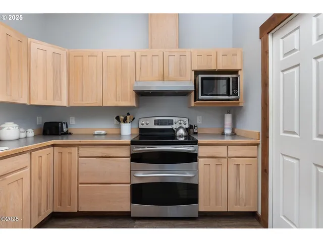 a kitchen with stainless steel appliances a refrigerator and a sink
