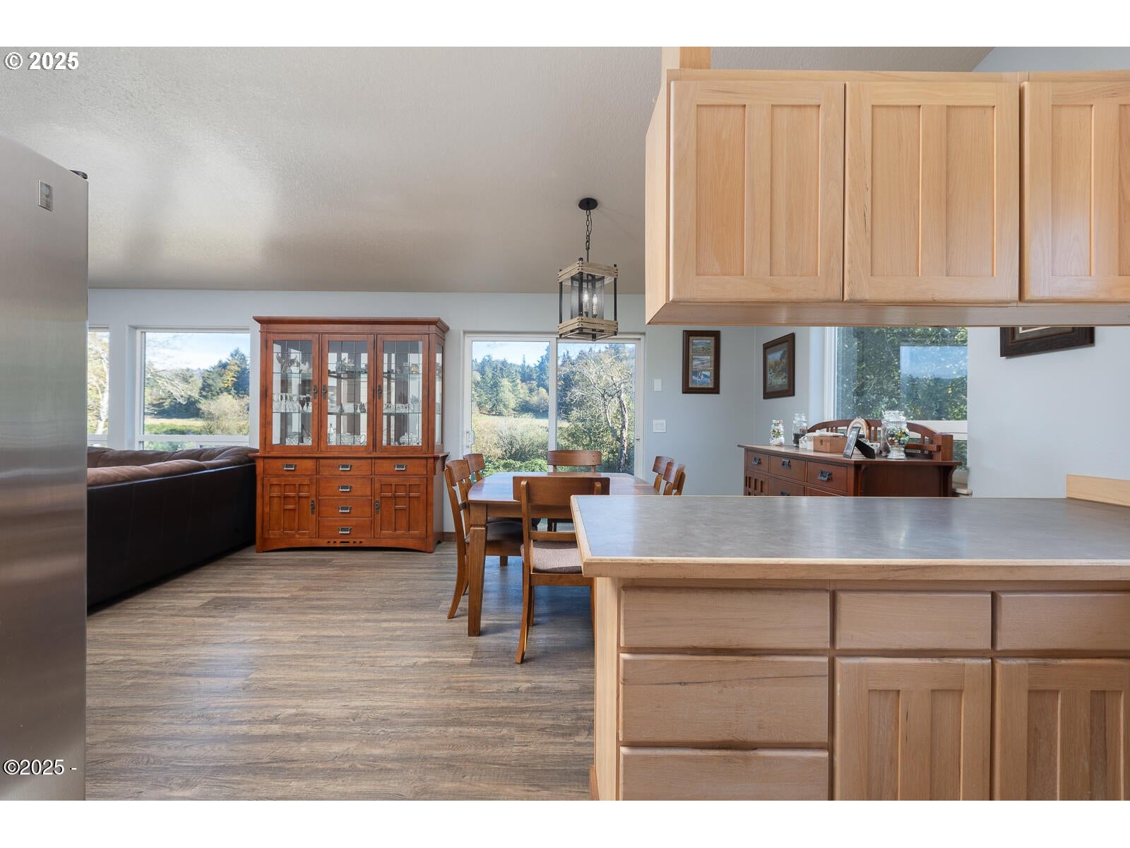 25855 Chinook Street Cloverdale, OR 97112 - Photo 14 of 26 a kitchen with cabinets wooden floor and a window