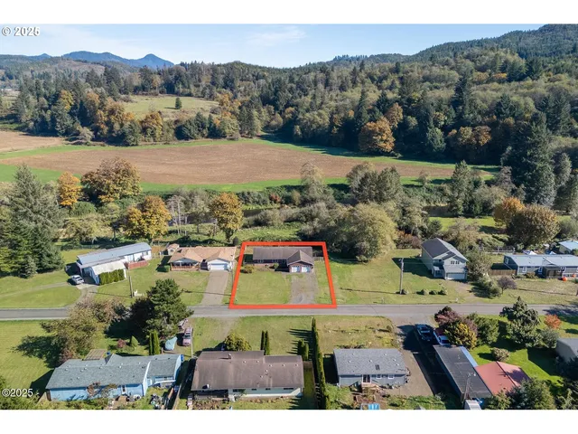 a view of a town with mountains in the background
