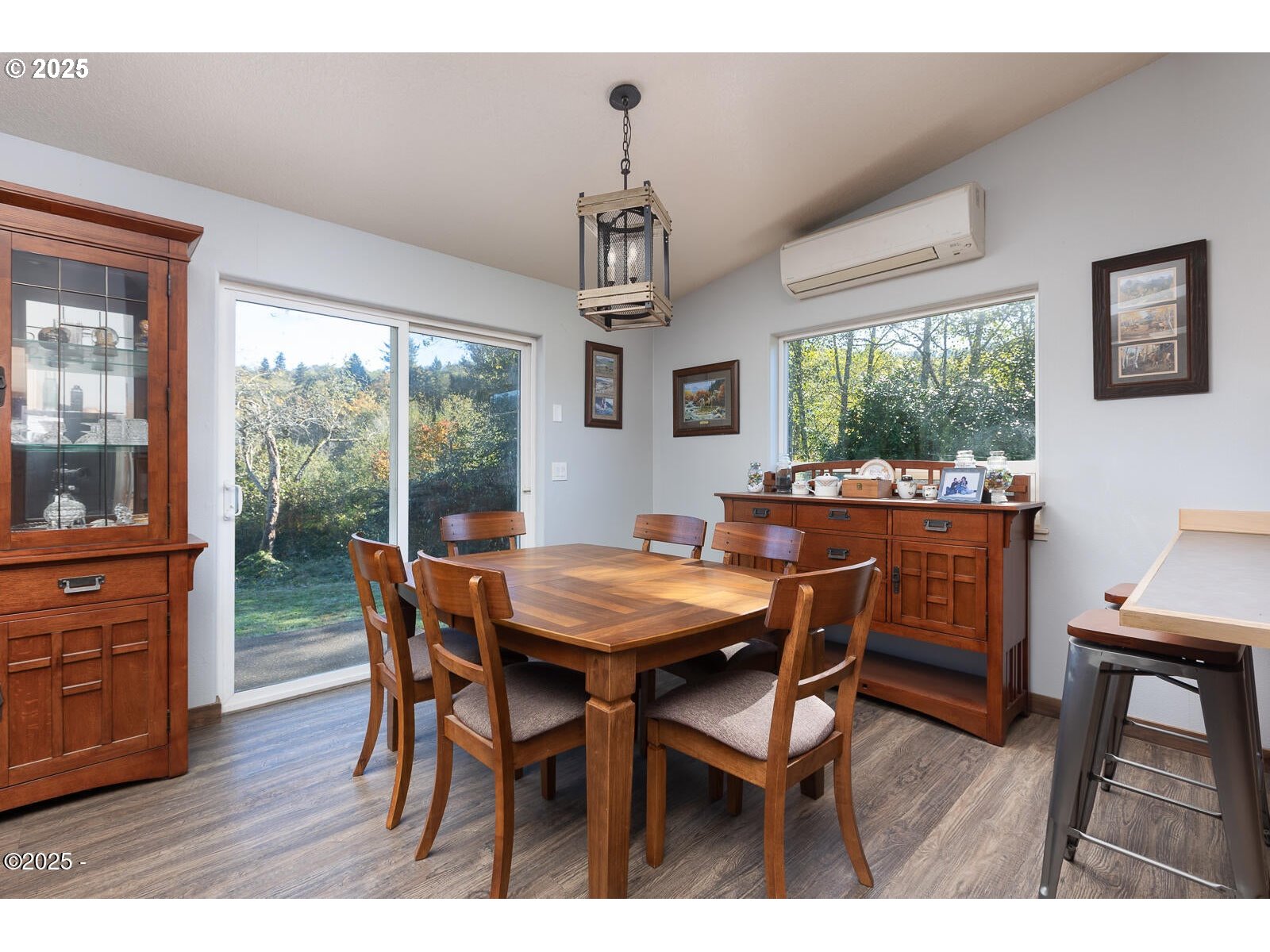 25855 Chinook Street Cloverdale, OR 97112 - Photo 9 of 26 a dining room with furniture a chandelier and wooden floor