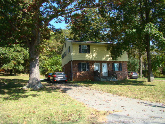 2110 Blue Ridge Springs Road, Unit 2112 Blue Ridge, VA 24064 - Photo 1 of 1 a front view of a house with a yard
