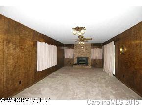 334 Queentown Road Canton, NC 28716 - Photo 6 of 9 a view of a hallway with a chandelier
