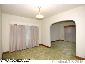 334 Queentown Road Canton, NC 28716 - Photo 7 of 9 a view of a livingroom with a chandelier
