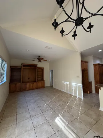 a view of a livingroom with furniture and cabinets