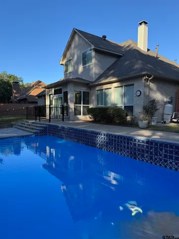 a front view of a house with swimming pool