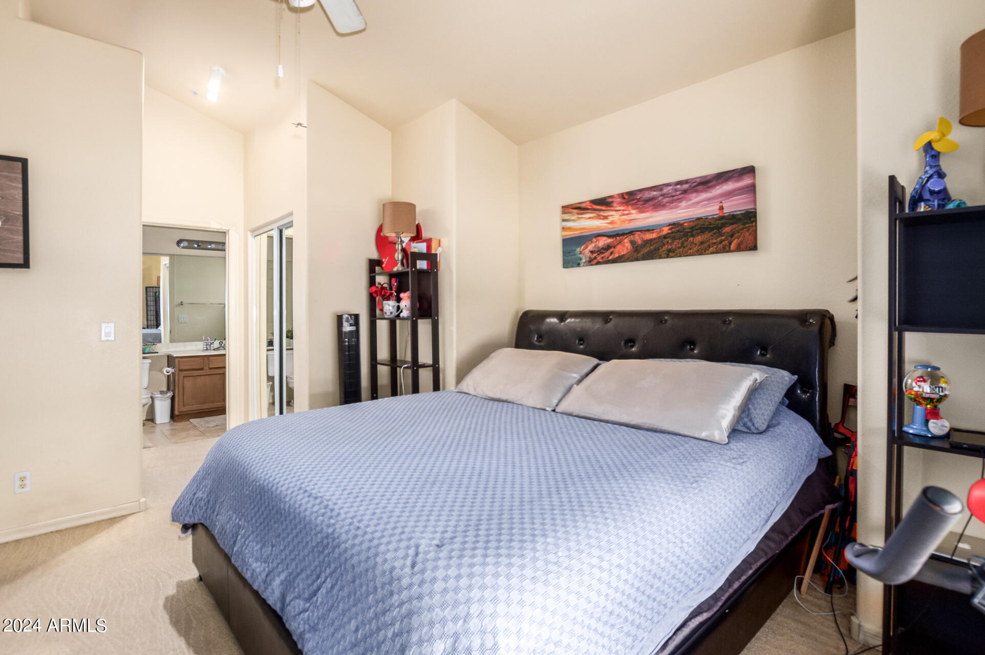 2801 North Litchfield Road, Unit 18 Goodyear, AZ 85395 - Photo 11 of 23 a bed room with a bed and a flat screen tv
