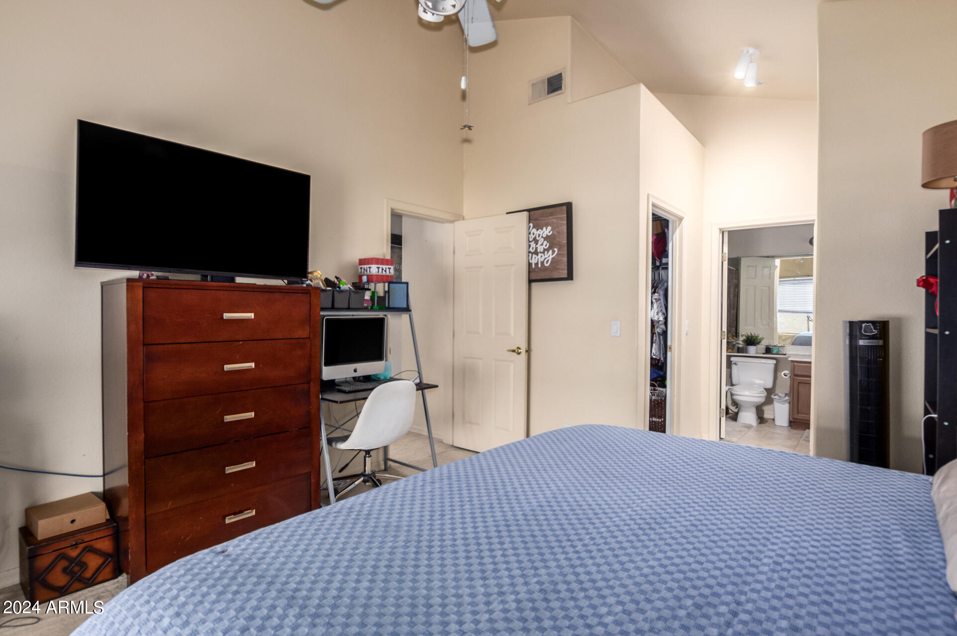 2801 North Litchfield Road, Unit 18 Goodyear, AZ 85395 - Photo 12 of 23 a bedroom with a bed and a flat screen tv