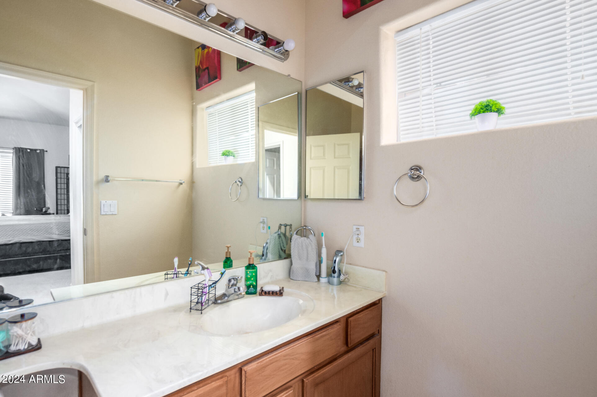 2801 North Litchfield Road, Unit 18 Goodyear, AZ 85395 - Photo 13 of 23 a bathroom with a sink and a mirror