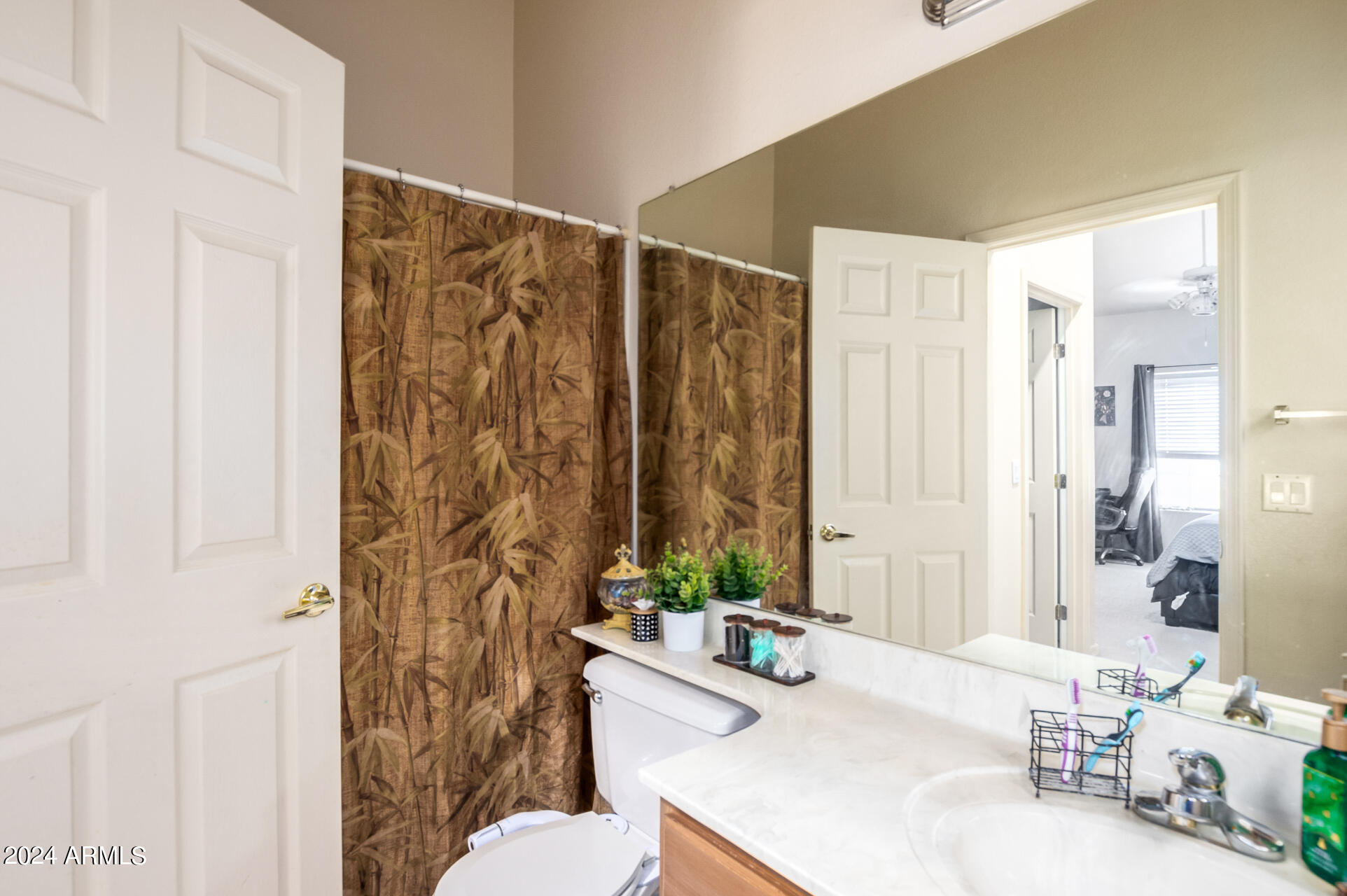 2801 North Litchfield Road, Unit 18 Goodyear, AZ 85395 - Photo 14 of 23 a bathroom with a sink a toilet and shower