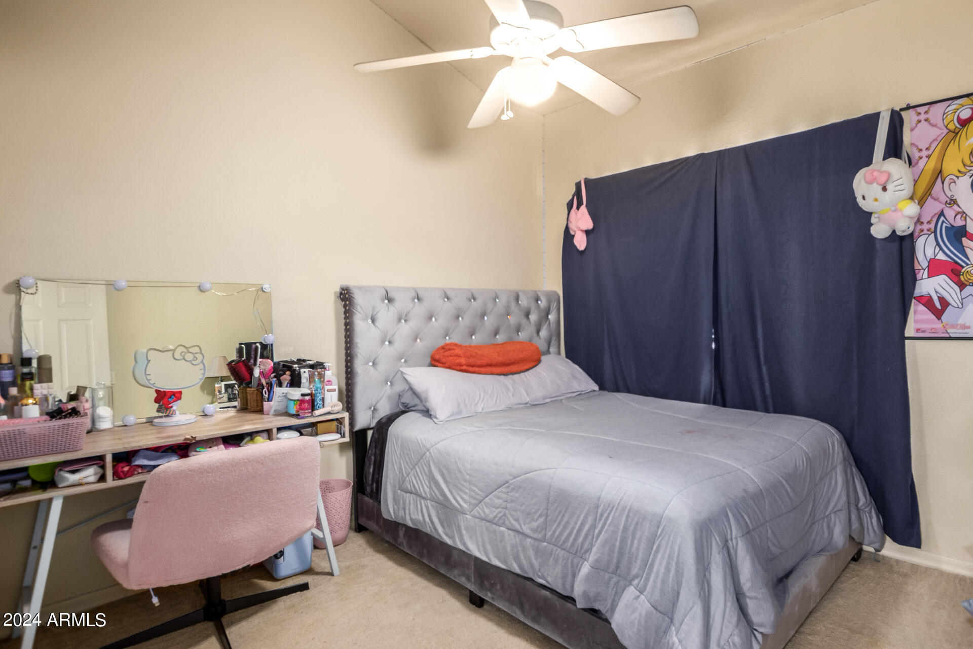 2801 North Litchfield Road, Unit 18 Goodyear, AZ 85395 - Photo 15 of 23 a bedroom with a bed and a chandelier