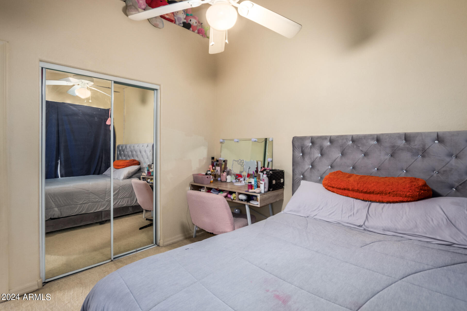 2801 North Litchfield Road, Unit 18 Goodyear, AZ 85395 - Photo 16 of 23 a bedroom with furniture and a chandelier