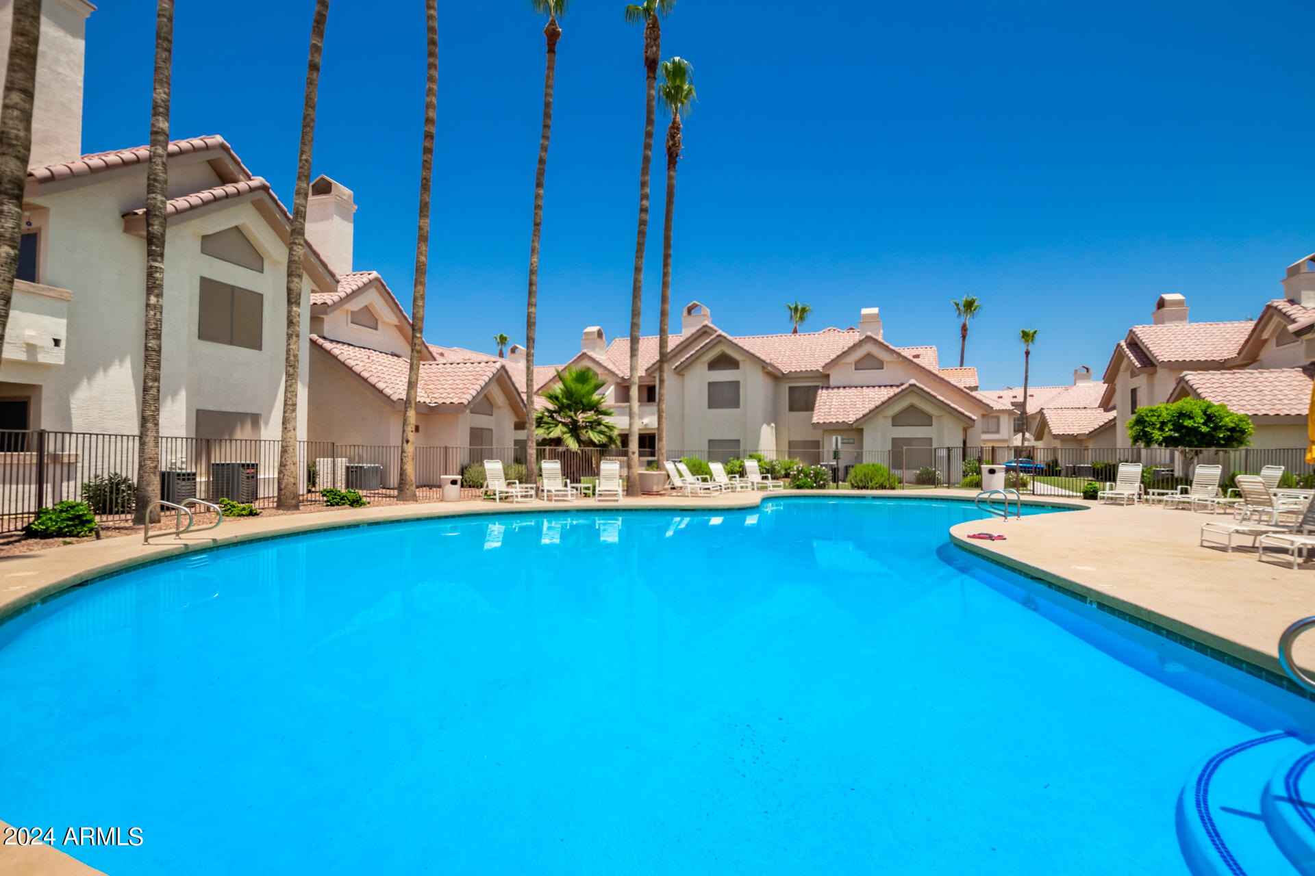 2801 North Litchfield Road, Unit 18 Goodyear, AZ 85395 - Photo 20 of 23 a view of a house with swimming pool