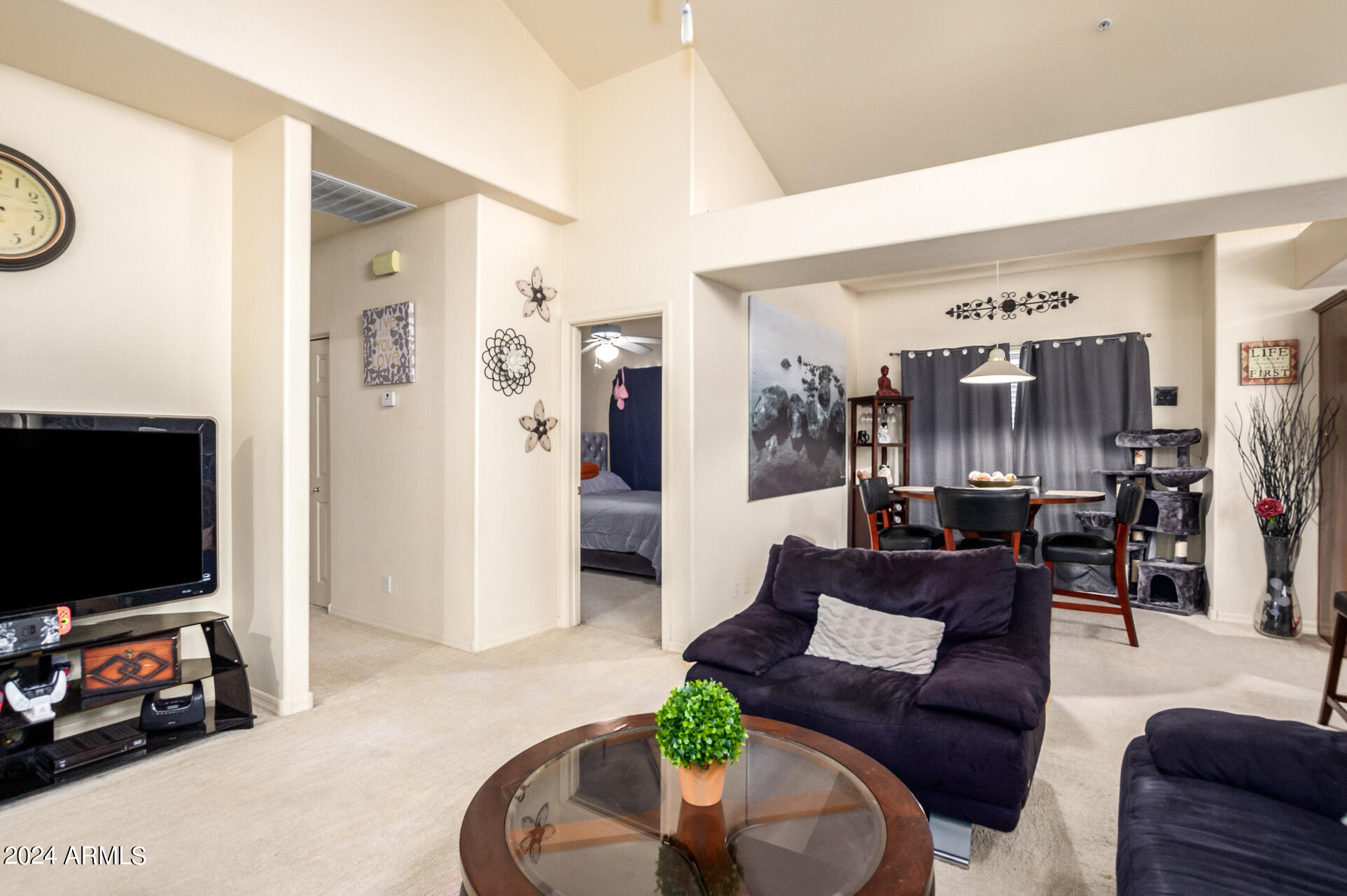 2801 North Litchfield Road, Unit 18 Goodyear, AZ 85395 - Photo 5 of 23 a living room with furniture and a flat screen tv