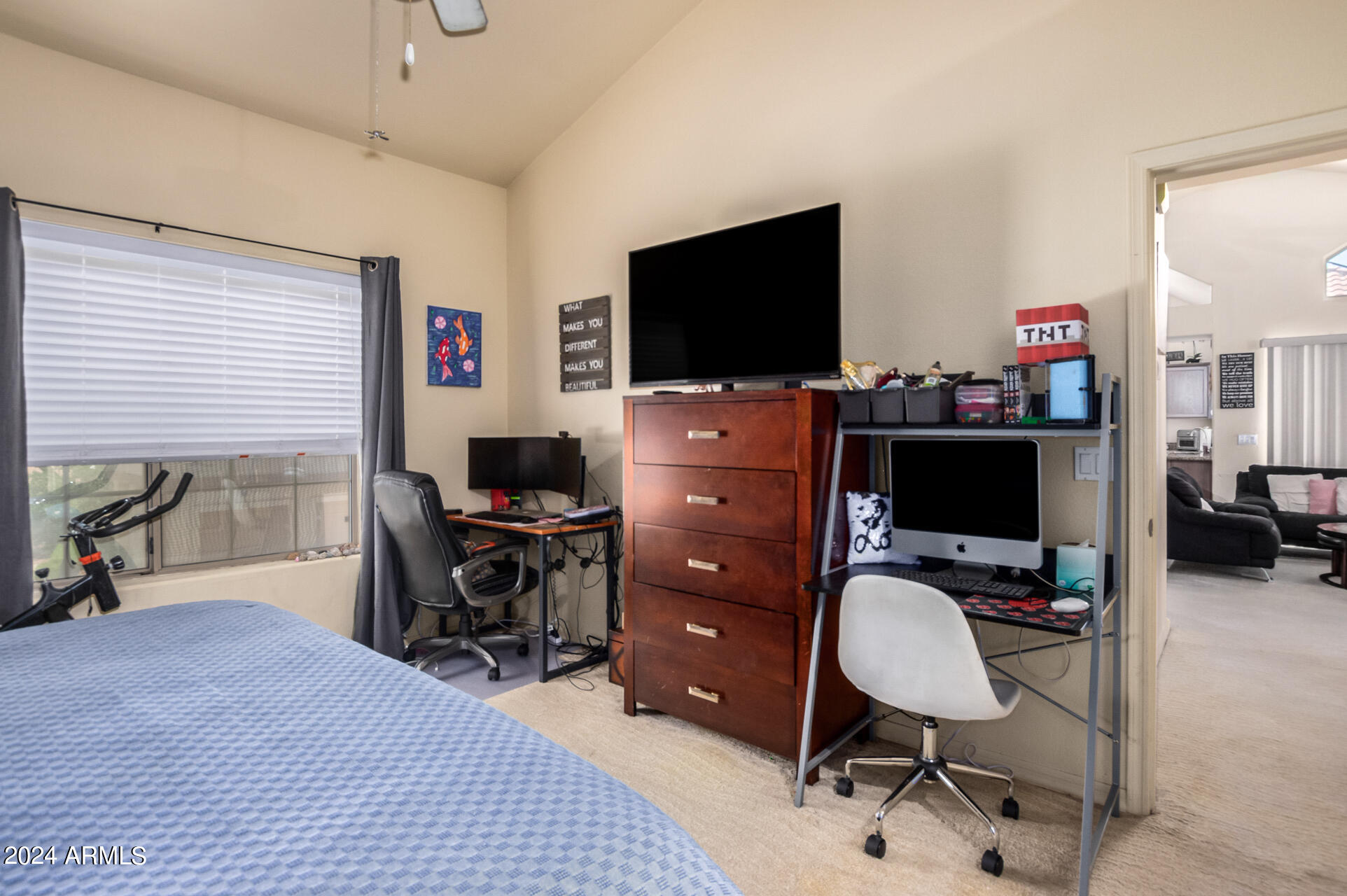 2801 North Litchfield Road, Unit 18 Goodyear, AZ 85395 - Photo 10 of 23 a work room with furniture and a flat screen tv