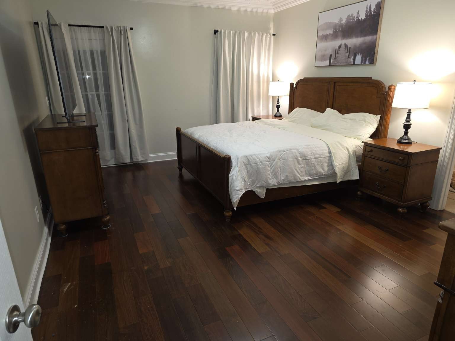 159 Clover Ridge Drive Madison, AL 35758 - Photo 22 of 69 a bedroom with a bed wooden floor and a mirror