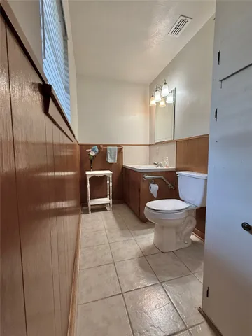 a bathroom with a toilet a sink and a shower